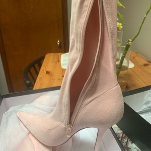 Soft pink over the knee boot .